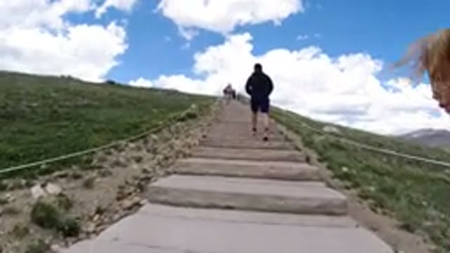 WINTER PARK COLORADO-2019: Child Climbing Up Stairs To Top Of Mountain