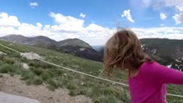 WINTER PARK COLORADO-2019: Little Girl Hiking Up The Mountain Side With A