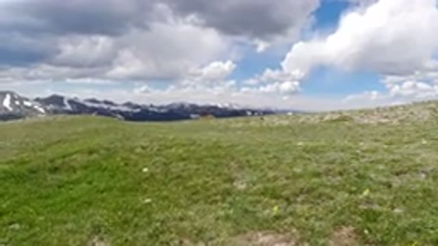 WINTER PARK COLORADO-2019: A Shaky Video Of A Landscape Of Mountains Green Grass