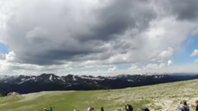 WINTER PARK COLORADO-2019: A Large Gathering Of People On A Green Field With A