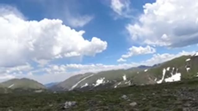WINTER PARK COLORADO-2019: Mountains Partially Covered In Snow In The Background