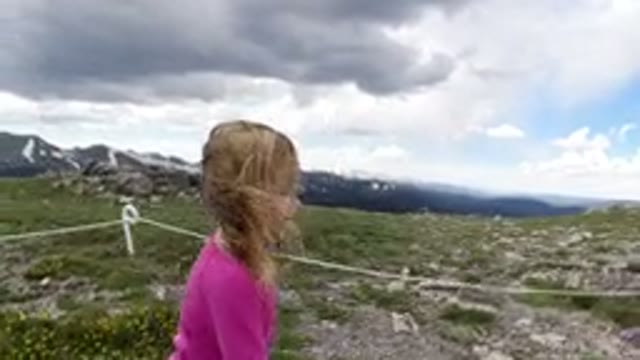 WINTER PARK COLORADO-2019: Little Girl And Accompanying Adult Walk Through Scenic Trail