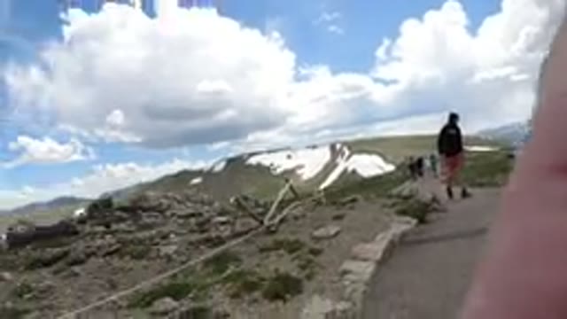 WINTER PARK COLORADO-2019: People Are Walking Through A Trail With Mountains In