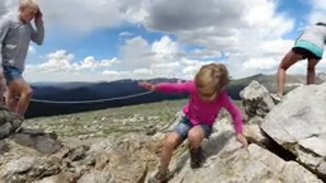 WINTER PARK COLORADO-2019: Little Girl Explores Big Rocks in Winter Park