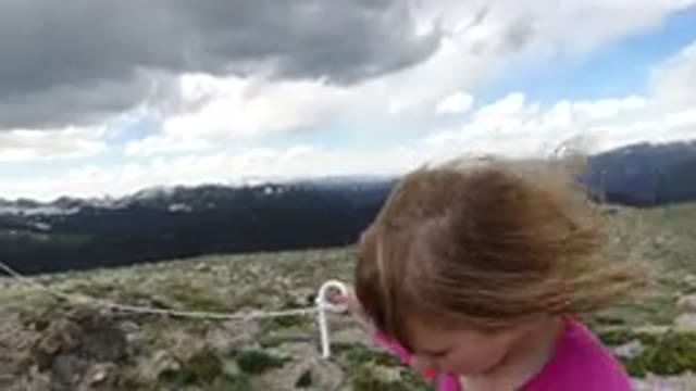 WINTER PARK COLORADO-2019: Little Girl Walking Outside Near Mountain Range On