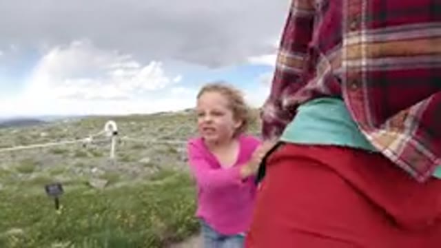 WINTER PARK COLORADO-2019: Girl Holding Hand Enjoying Breeze