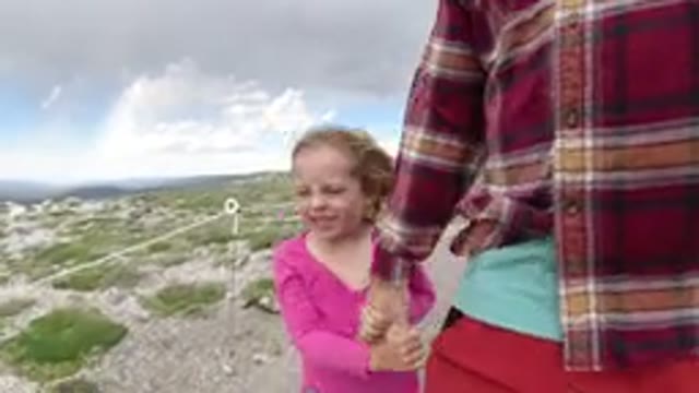 WINTER PARK COLORADO-2019: Little Girl Walks With Her Dad On A Windy Day