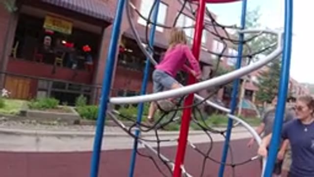WINTER PARK COLORADO-2019: Child Trying To Climb Net Monitoring By Parents In Winter Park