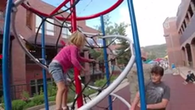 WINTER PARK COLORADO-2019: A Girl Is Playing In The Park With A Man