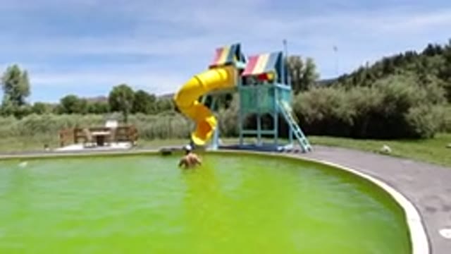 WINTER PARK COLORADO-2019: Man Enjoying The Green Massive Pool In Winter Park