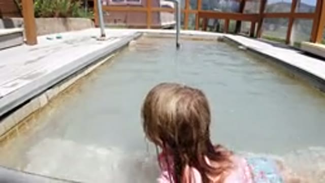 WINTER PARK COLORADO-2019: Cute Baby Learning To Swim In A Home Pool