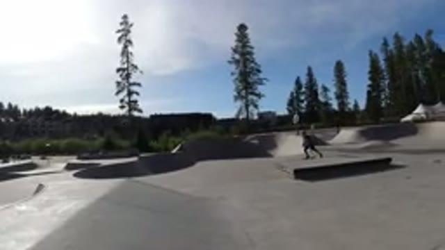 WINTER PARK COLORADO-2019: Two Boys Skateboarding in Skateboard Ground and One
