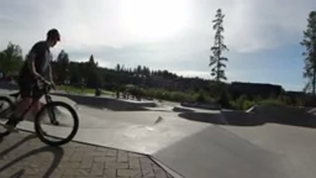 WINTER PARK COLORADO-2019: Bikers And Skateboarders Performing Stunts At The Skatepark