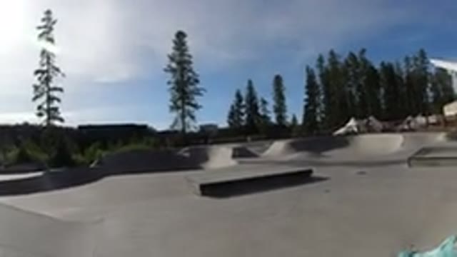 WINTER PARK COLORADO-2019: Young Teenager Riding A Bike Up A Ramp In A Skate Park