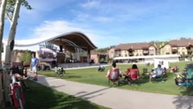 WINTER PARK COLORADO-2019: Crowd of People Sitting in Colorful Chairs at Outdoor Gathering