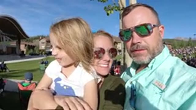 WINTER PARK COLORADO-2019: A Family Shares A Kiss At An Outdoor Function