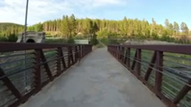 WINTER PARK COLORADO-2019: Walking Over A Bridge In The Countryside With A Small Dog