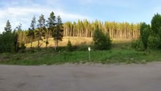 WINTER PARK COLORADO-2019: A Gravel Parking Area With Reflective Markers On Its Edge