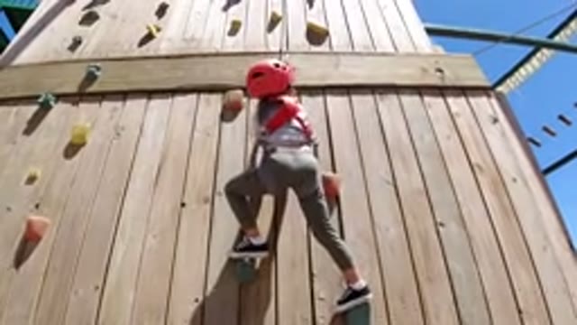 WINTER PARK COLORADO-2019: One Girl Playing On The Wood Wall Climbing