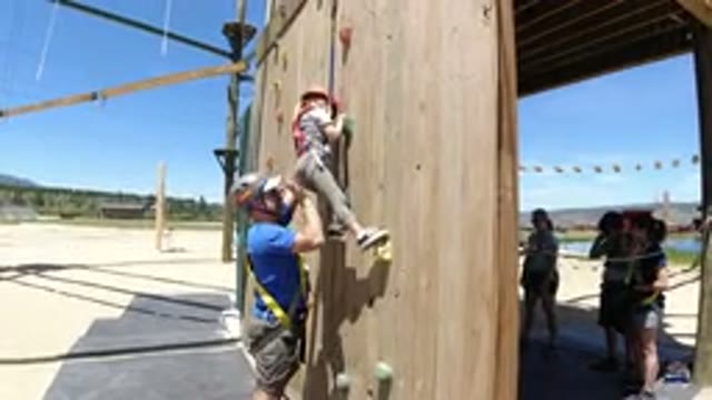 WINTER PARK COLORADO-2019: Dad Helping Little Girl Climb Wall