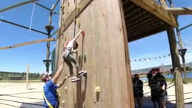 WINTER PARK COLORADO-2019: Trainer Is Training A Kid To Climb A Wall She Was