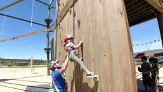 WINTER PARK COLORADO-2019: A Little Girl in a Harness Learning to Rock Climb