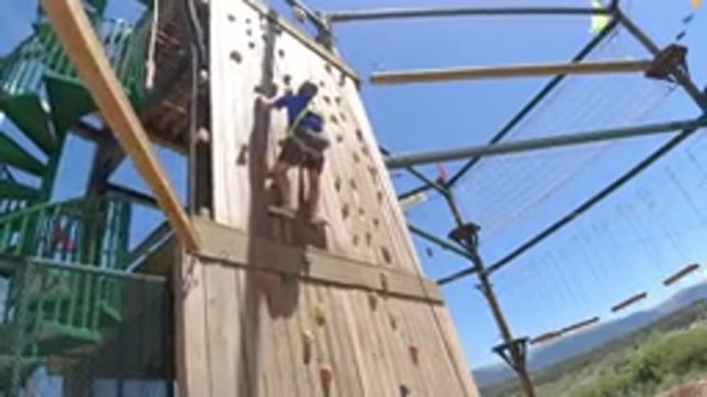 WINTER PARK COLORADO-2019: A Boy Climbs a Wooden Structure to Win a Game