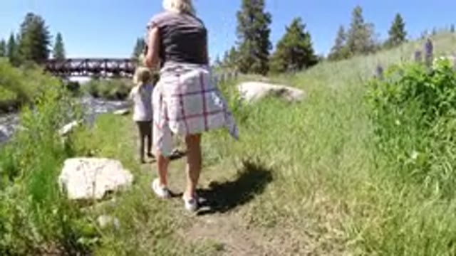 WINTER PARK COLORADO-2019: Mom And Daughter In The Middle Of The Flowing Water