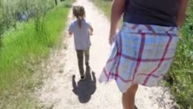 WINTER PARK COLORADO-2019: Mother And Daughter Walking Together In Nature With