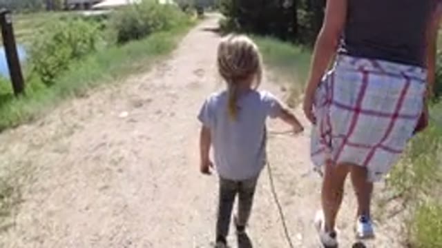 WINTER PARK COLORADO-2019: A Mom And Daughter Walking On The Single Track Way