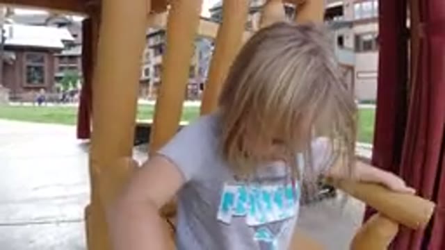 WINTER PARK COLORADO-2019: Girl Rocking In Wooden Chair