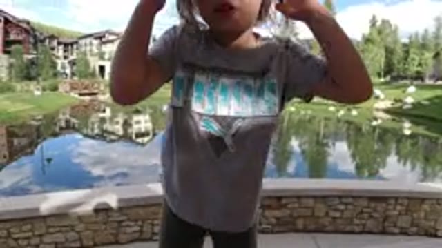 WINTER PARK COLORADO-2019: Little Girl Discovers Bird Free In The Lake Near The