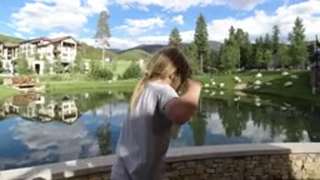 WINTER PARK COLORADO-2019: Blonde Child Dancing In Front Of The Lake With
