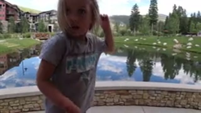 WINTER PARK COLORADO-2019: Little Child Having Fun In Front Of A Lake On A