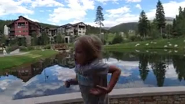 WINTER PARK COLORADO-2019: A Little Girl Singing and Walking on the Bridge