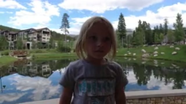 WINTER PARK COLORADO-2019: A Small Girl Playing With Her Mom In Snowy Park