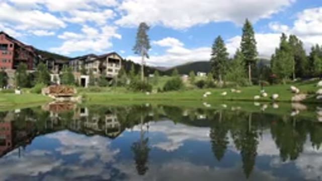 WINTER PARK COLORADO-2019: Tranquil Lake Rippling in Front of a Large Building