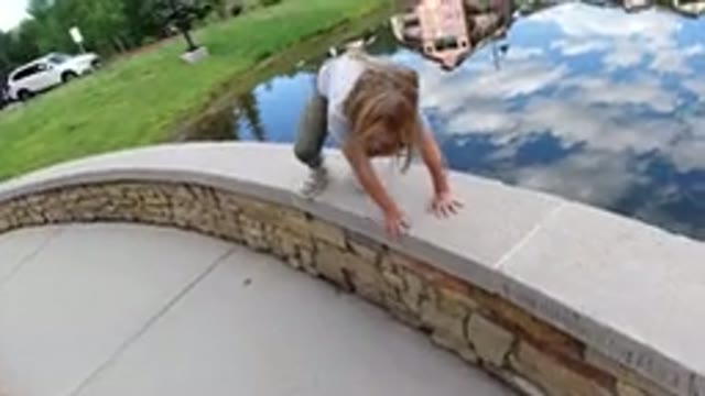 WINTER PARK COLORADO-2019: The Girl Is Playing Near The Lake And She Jumped And