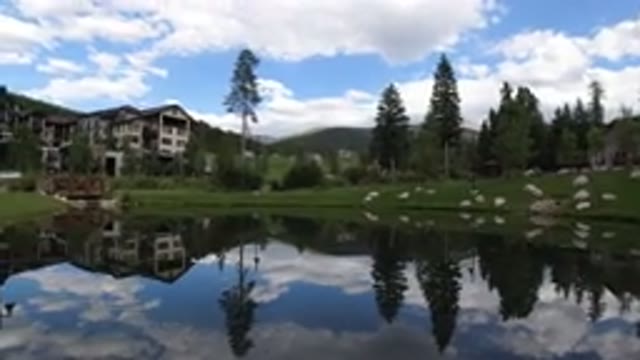 WINTER PARK COLORADO-2019: Raindrops Falling on Lake Beside Trees and Houses