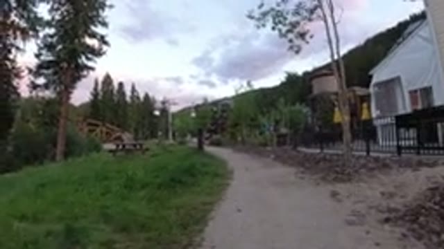 WINTER PARK COLORADO-2019: Bench On Grass Left Side Of Path