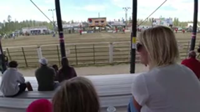 WINTER PARK COLORADO-2019: Mom And Daughter Sit On Bleachers And Watch Outdoor Event