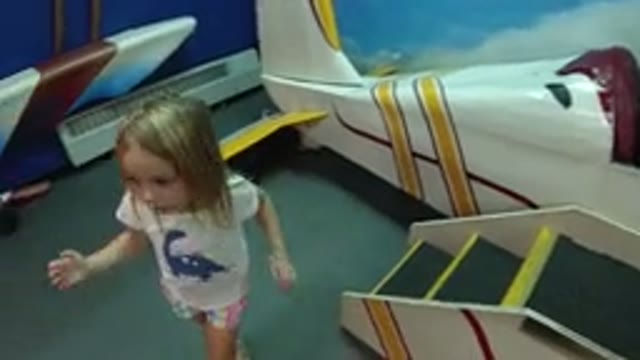 WHEAT RIDGE COLORADO-2019: A Little Girl Hesitated To Ride The Playground Plane