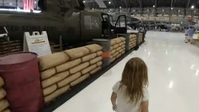WHEAT RIDGE COLORADO-2019: Little Girl At A Tank Museum Looking At All The Vehicles