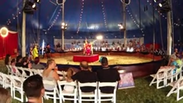 BROOMFIELD COLORADO-2019: Four Performers in Red Execute Circus Act on Stage