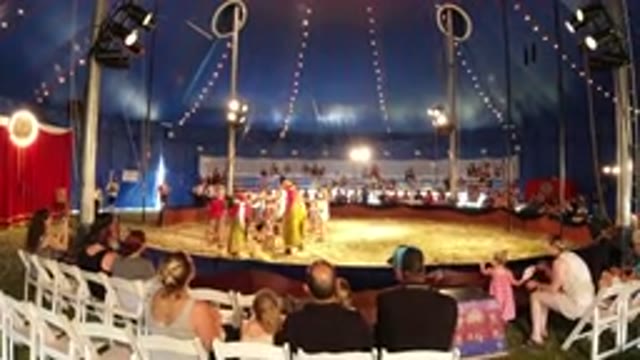 BROOMFIELD COLORADO-2019: Family Watches Volunteers Play With Clown In The