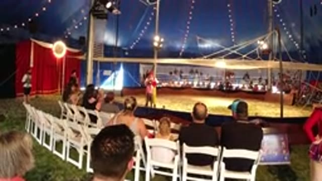 BROOMFIELD COLORADO-2019: Large Stage With Bright Lights And Two People Walking