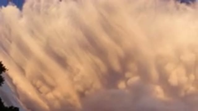 BROOMFIELD COLORADO-2019: Left To Right Panoramic Of A Large Cloud Above Trees