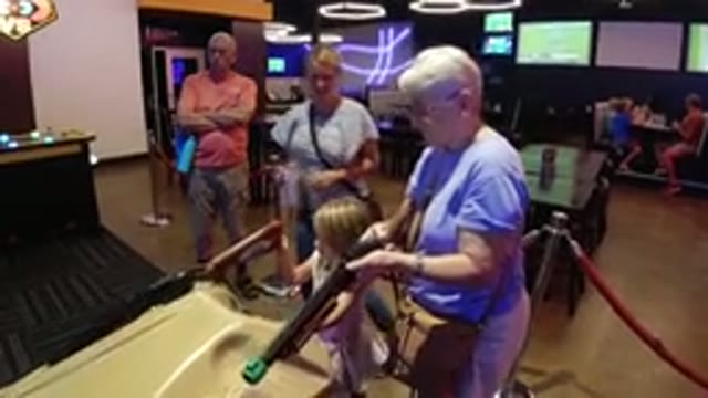 BROOMFIELD COLORADO-2019: Grandmother And Granddaughter Playing Arcade Game