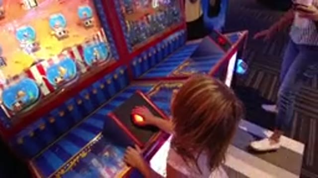BROOMFIELD COLORADO-2019: Video Of A Girl Playing A Virtual Game On A TV Screen
