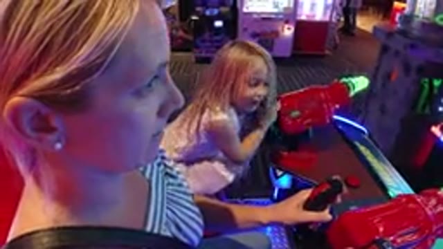 BROOMFIELD COLORADO-2019: Mom Playing With Her Daughter in Laser War at an Arcade
